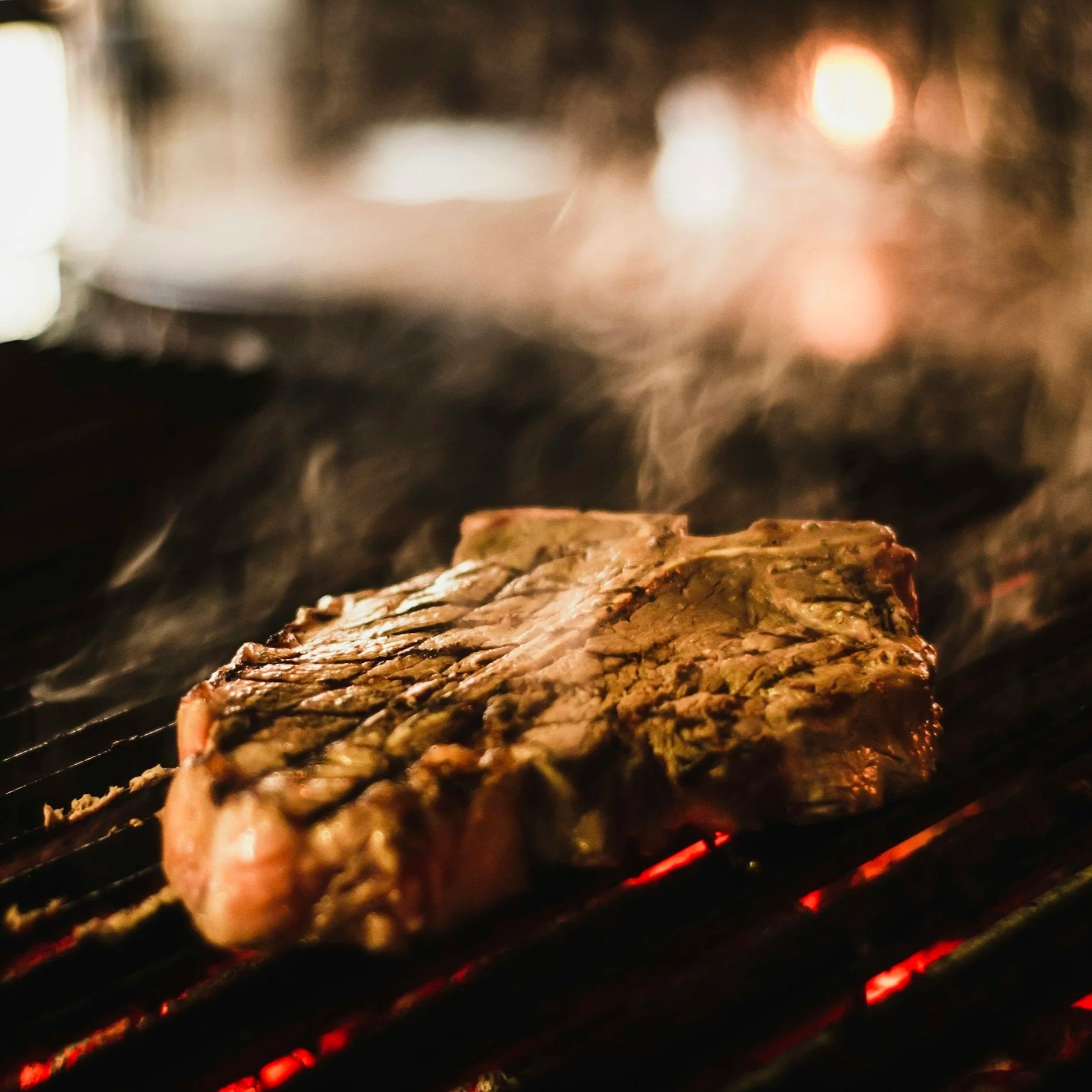 Beef steak being grilled
