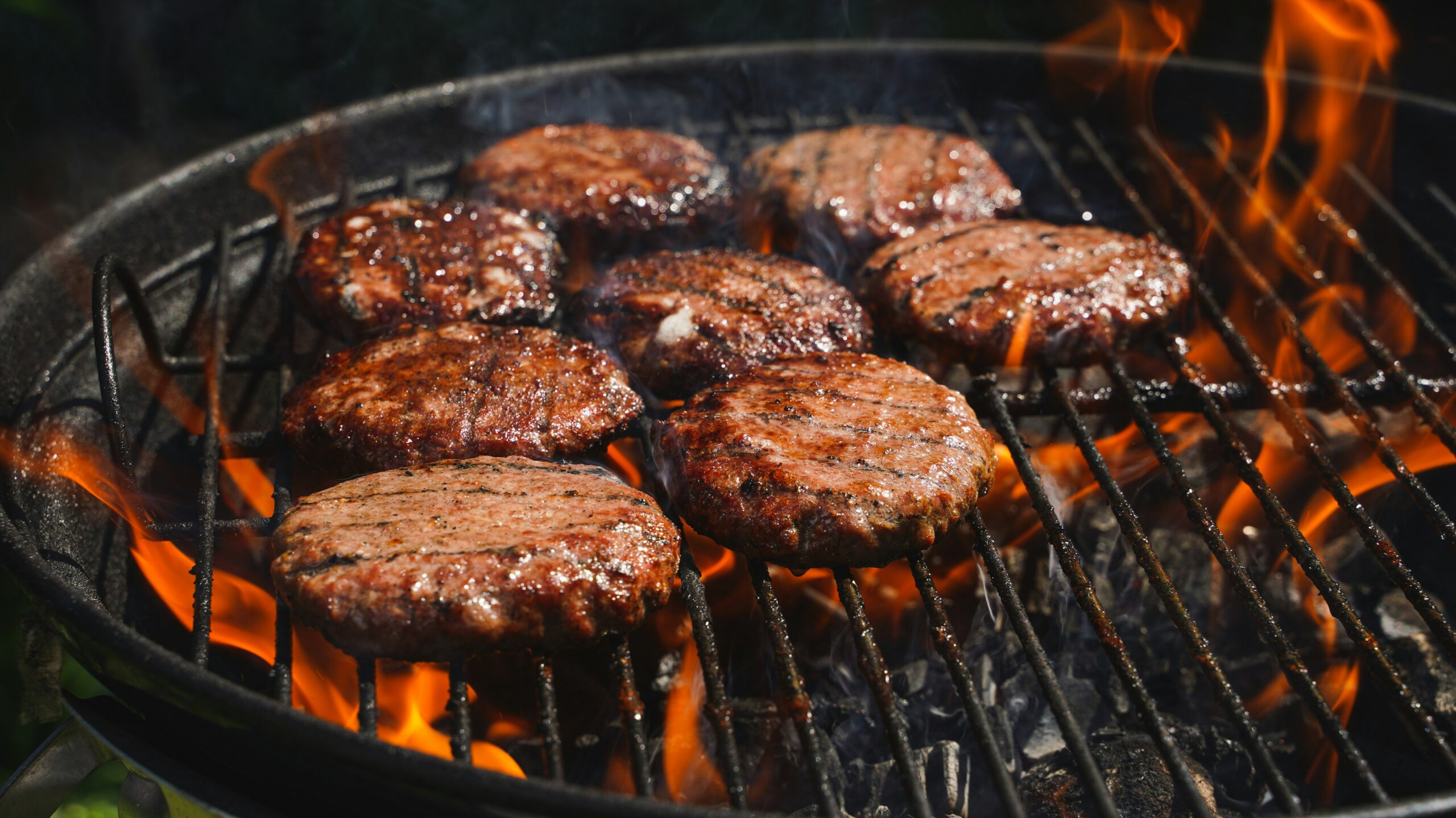 ground beef patties being grilled
